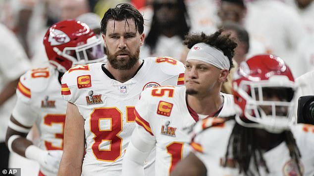 Kansas City Chiefs tight end Travis Kelce (87) quarterback Patrick Mahomes (15) and running back Kareem Hunt (29) walk off the field