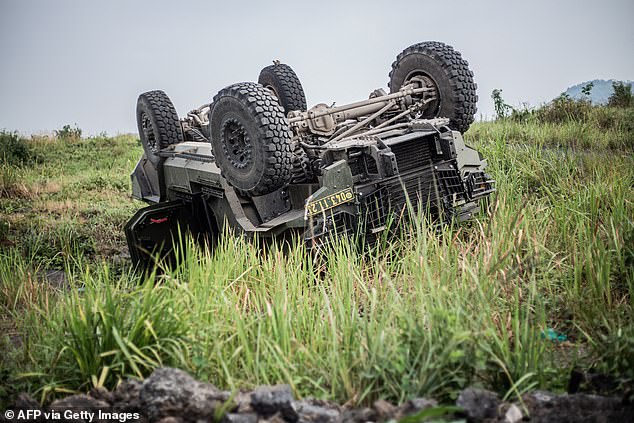 An upturned armored vehicle of the Democratic Republic of Congo Armed Forces (FARDC) is seen in Sake on February 9, 2025