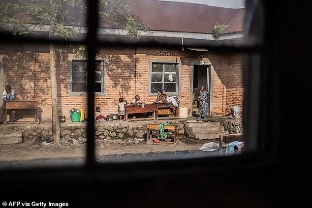 Displaced people who fled the fighting in Kibati and Kihisi and have taken refuge are seen inside EP Djiwe Primary School in Goma on February 10, 2025