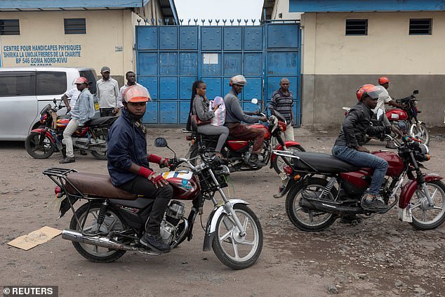 People react during the removal of bodies who died in a jailbreak and fire at Munzenze central prison in Goma, North Kivu province, Democratic Republic of Congo, February 10, 2025